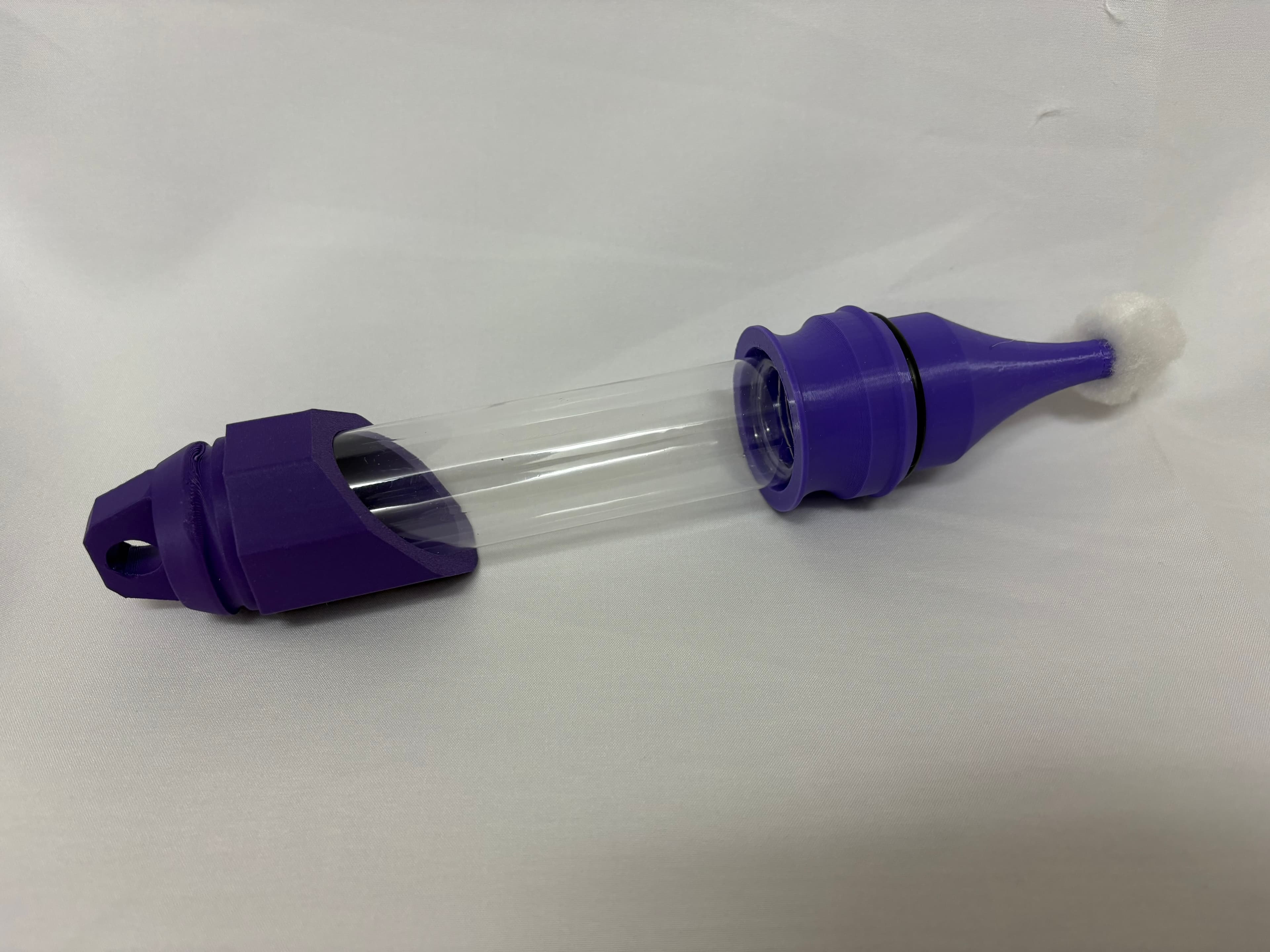 A polished purple 3D-printed Primer Wand prototype, fully assembled.