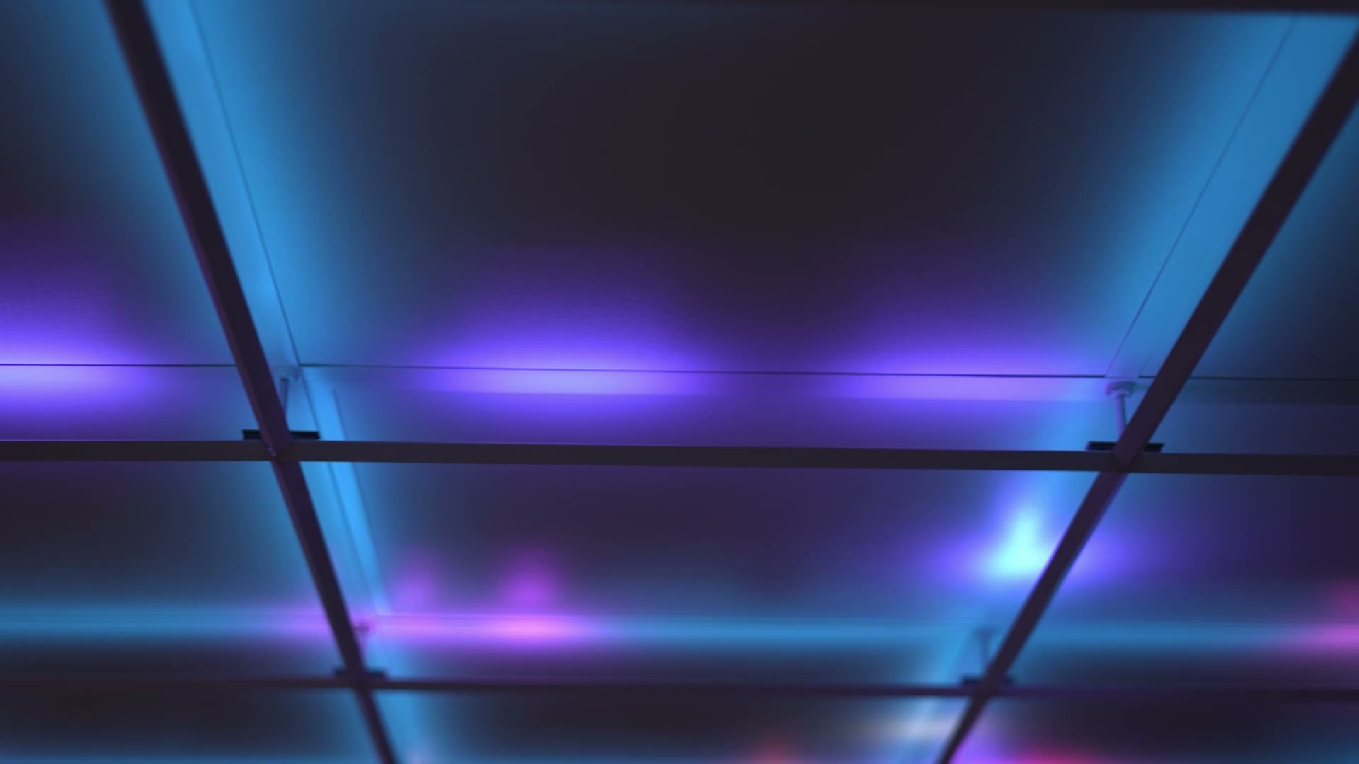 A dynamic GridLights ceiling cycling through ambient color states.